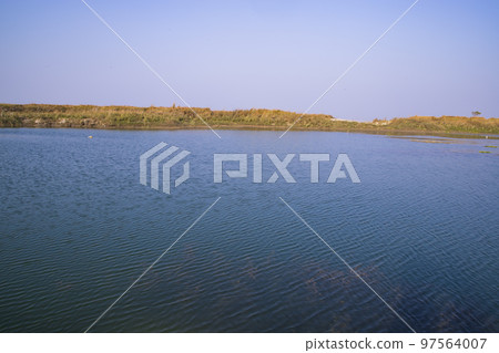 Crystal clear blue water lake landscape view nearby Padma river in Bangladesh 97564007