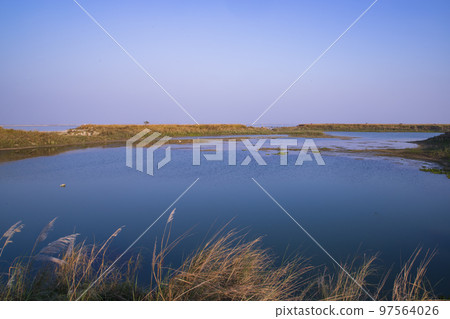 Crystal clear blue water lake landscape view nearby Padma river in Bangladesh Crystal clear blue water lake landscape view nearby Padma river in Bangladesh 97564026