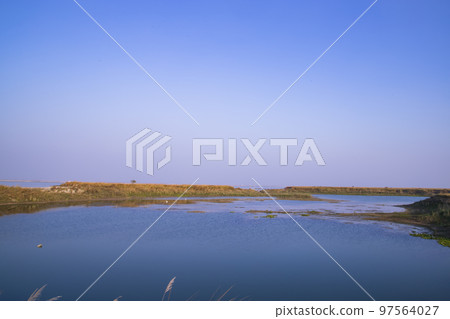 Crystal clear blue water lake landscape view nearby Padma river in Bangladesh Crystal clear blue water lake landscape view nearby Padma river in Bangladesh 97564027