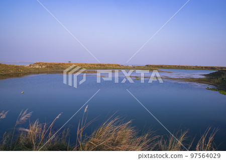 Crystal clear blue water lake landscape view nearby Padma river in Bangladesh Crystal clear blue water lake landscape view nearby Padma river in Bangladesh 97564029