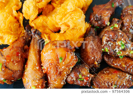 caramelized chicken with sesame and garlic, meat strips in breadin. 97564306