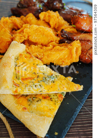 cheese pizza, caramelized chicken with sesame and garlic, meat strips in breadin 97564309