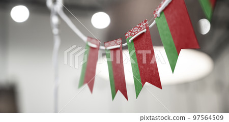 A garland of Belarus national flags on an abstract blurred background 97564509