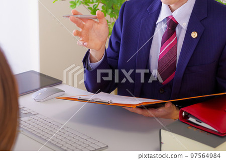 Male lawyer listening to legal advice 97564984