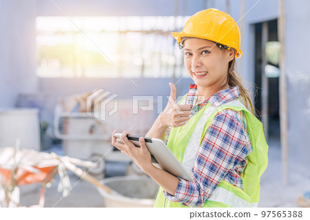 portrait engineer woman worker as builder project manager inspector happy smile thumbs up with tablet portrait engineer woman worker as builder project manager inspector happy smile thumbs up with tablet 97565388
