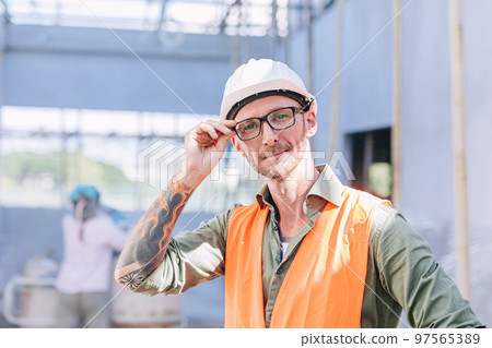 portrait smart middle age builder engineer worker male master skill artisan look with arm tattoo portrait smart middle age builder engineer worker male master skill artisan look with arm tattoo 97565389
