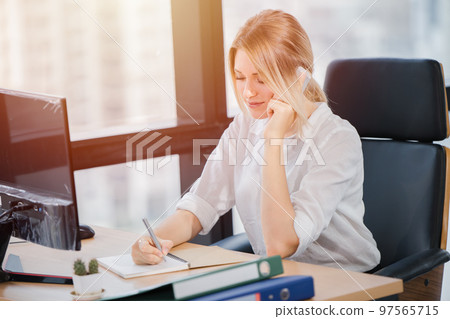 office employee sale marketing working phone calling customer service support receiving order from customer. 97565715