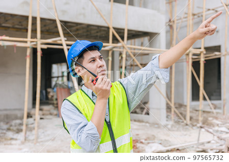 foreman engineer builder male worker intend to working hard at construction site home building project 97565732