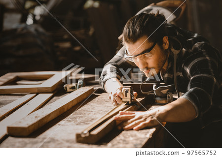 carpenter man furniture artisan handcrafted making woodwork at wood workshop 97565752
