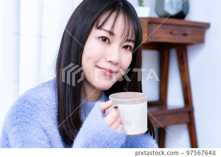 knitted woman drinking coffee knitted woman drinking coffee 97567648