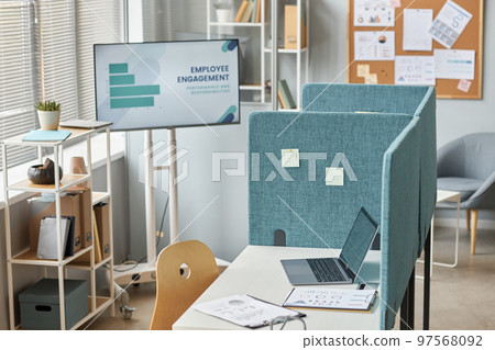 Office workplace cubicle with laptop on desk Office workplace cubicle with laptop on desk 97568092