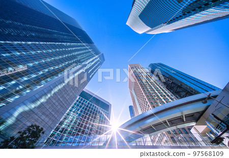 Tokyo cityscape in Japan Diamond Shiodome in winter. Overlooking Shiodome offices under clear blue skies in winter 97568109