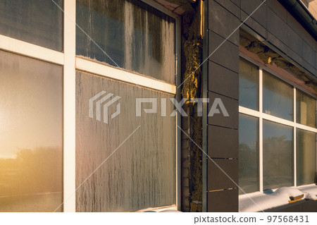 Outside wall heat isolation with mineral wool, building under construction Outside wall heat isolation with mineral wool, building under construction 97568431