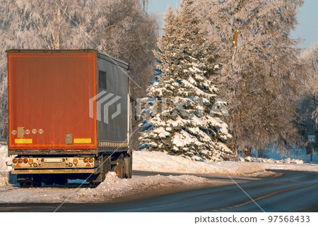 Rear view of cargo car in winter parked on the side of the road Rear view of cargo car in winter parked on the side of the road 97568433
