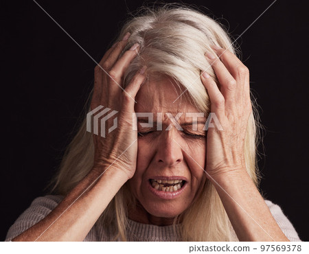 Mental health, depression and face of senior woman sad over loss, crisis problem and suffer from anxiety stress. Pain, dark fear and crying elderly person depressed over trauma on black background 97569378