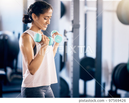 Fitness, dumbbell and training with woman at gym for weightlifting, health and sports workout. Energy, challenge and performance with girl bodybuilder lifting weights for power, strong and muscle 97569426