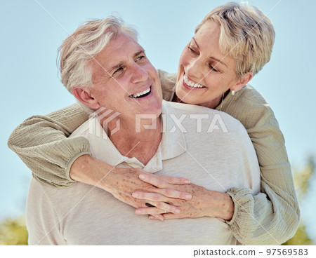 Elderly, couple hug and love outdoor with marriage, support and trust, happy in retirement together. Life insurance, retired and wellness with respect, calm and happiness in relationship in Boston 97569583