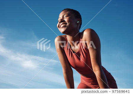 Fitness, black woman and smile in relax for running, exercise or workout in the nature outdoors. Happy African American female runner smiling on a break from run, exercising and breathing fresh air 97569641