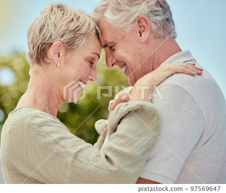Hug, elderly and couple with love and trust in marriage, retirement and quality time outdoor, park with nature and commitment. Life partner, care and comfort, happy and retired, man and woman profile 97569647
