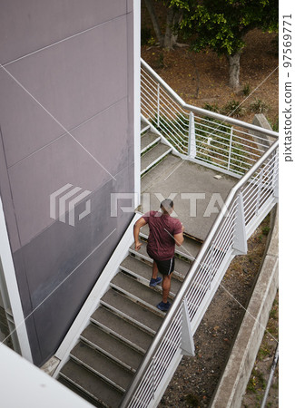 Runner, staircase and outdoor workout for fitness, sports wellness or running exercise. Building stairs, marathon training run in morning and healthy athlete person fon cardio performance motivation Runner, staircase and outdoor workout for fitness, sports wellness or running exercise. Building stairs, marathon training run in morning and healthy athlete person fon cardio performance motivation 97569771