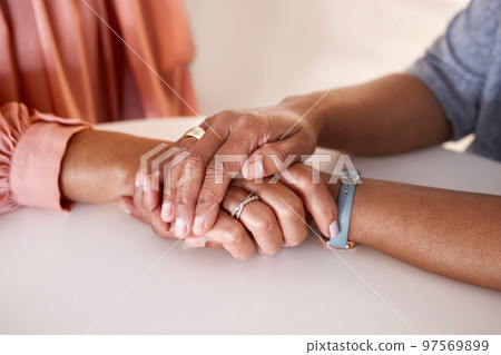 Hands, women and holding closeup in support of comfort, empathy and unity in crisis, cancer or bad news. Hand, zoom and friends holding hands for hope, trust and prayer for girl suffering depression Hands, women and holding closeup in support of comfort, empathy and unity in crisis, cancer or bad news. Hand, zoom and friends holding hands for hope, trust and prayer for girl suffering depression 97569899