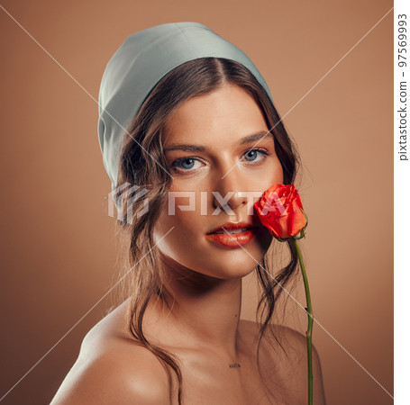 Rose, woman and face with natural beauty, skincare and luxury cosmetics of floral aesthetic, perfume or facial makeup on studio background. Headshot, portrait and model with roses, nature and flowers Rose, woman and face with natural beauty, skincare and luxury cosmetics of floral aesthetic, perfume or facial makeup on studio background. Headshot, portrait and model with roses, nature and flowers 97569993