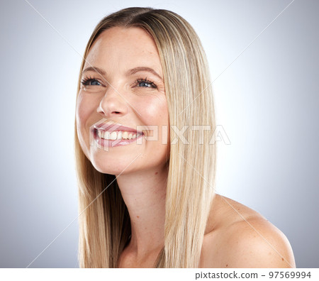 Beauty, woman and hair in studio with blonde color, shine and glow from rich keratin texture, wellness and skincare on gray background. Happy model, natural cosmetics and healthy hair care shampoo Beauty, woman and hair in studio with blonde color, shine and glow from rich keratin texture, wellness and skincare on gray background. Happy model, natural cosmetics and healthy hair care shampoo 97569994