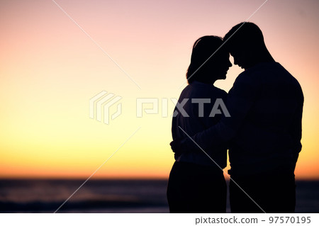 Couple, silhouette and sunset at beach for love, care and romantic date together with mockup on horizon sky. Shadow of man, woman and people hug at sea for travel, honeymoon vacation and calm holiday Couple, silhouette and sunset at beach for love, care and romantic date together with mockup on horizon sky. Shadow of man, woman and people hug at sea for travel, honeymoon vacation and calm holiday 97570195