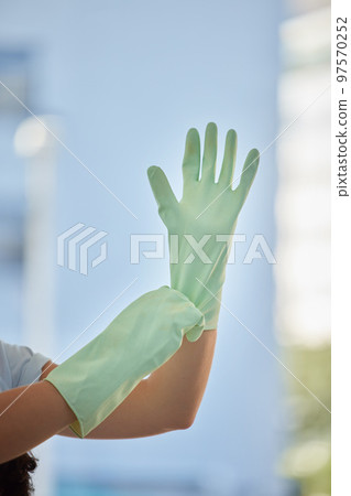 Woman, hands and gloves for cleaning home, hygiene and wellness. Spring cleaning, housekeeper or female cleaner getting ready for cleaning service to disinfect house to remove bacteria, germs or dust 97570252