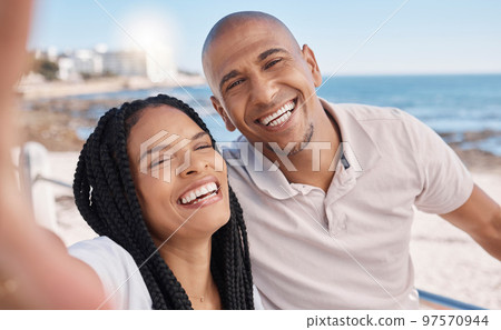 Holiday selfie, happy and black couple at the beach, honeymoon peace and relax by the ocean in Puerto Rico. Memory, smile and portrait of an excited man and woman with a photo on vacation by the sea Holiday selfie, happy and black couple at the beach, honeymoon peace and relax by the ocean in Puerto Rico. Memory, smile and portrait of an excited man and woman with a photo on vacation by the sea 97570944