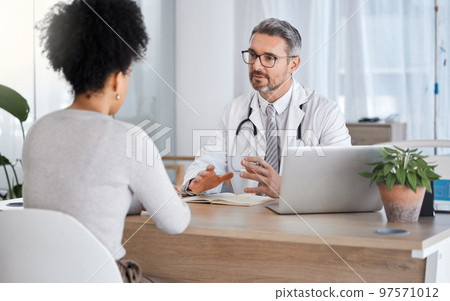 Healthcare, consultation and doctor talking to woman in after checkup, medical appointment and diagnosis. Wellness, support and medical worker in discussion with female patient in hospital or clinic 97571012