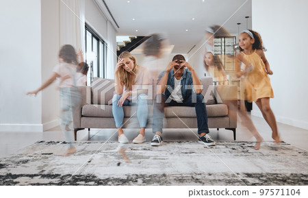 Stress, headache and parents and running children in house living room or family home with adhd, mental health or hyper active energy. Mother, father or family with kids noise, autism or bad behavior 97571104