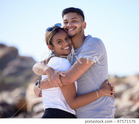 Love, beach and portrait of couple hug enjoying summer vacation, holiday travel and weekend together. Dating, romance and young man and woman hugging, smile and bonding for quality time in nature Love, beach and portrait of couple hug enjoying summer vacation, holiday travel and weekend together. Dating, romance and young man and woman hugging, smile and bonding for quality time in nature 97571576