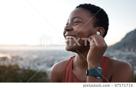 Black woman, laughing face or fitness earphones in sunset workout, healthcare training or cardiovascular exercise in sunrise wellness. Zoom, happy smile or sports runner listening to motivation music Black woman, laughing face or fitness earphones in sunset workout, healthcare training or cardiovascular exercise in sunrise wellness. Zoom, happy smile or sports runner listening to motivation music 97571719