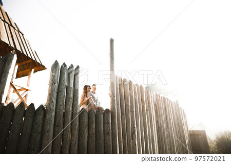 Amazing happy gentle stylish beautiful romantic caucasian couple on the background ancient baroque castle 97572021