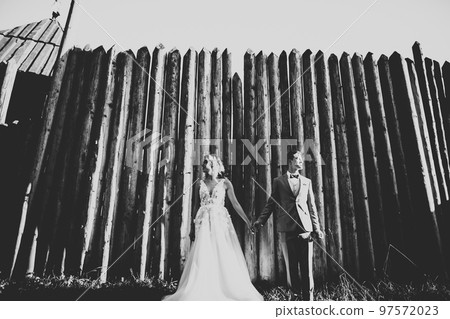 Amazing happy gentle stylish beautiful romantic caucasian couple on the background ancient baroque castle 97572023