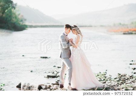 Wedding couple bride and groom holding hands 97572032