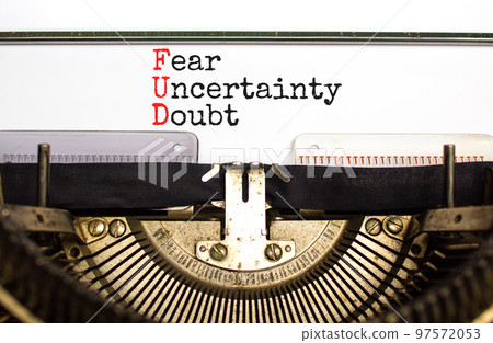 FUD fear uncertainty doubt symbol. Concept words FUD fear uncertainty doubt typed on old retro typewriter. Beautiful white background. Business and FUD fear uncertainty doubt concept. Copy space. FUD fear uncertainty doubt symbol. Concept words FUD fear uncertainty doubt typed on old retro typewriter. Beautiful white background. Business and FUD fear uncertainty doubt concept. Copy space. 97572053