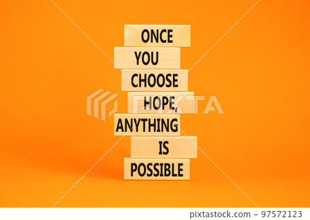 Hope and anything is possible symbol. Concept words Once you choose hope anything is possible on wooden blocks on a beautiful orange table orange background. Business and hope concept. Copy space Hope and anything is possible symbol. Concept words Once you choose hope anything is possible on wooden blocks on a beautiful orange table orange background. Business and hope concept. Copy space 97572123
