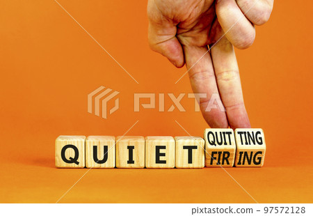 Quiet quitting or firing symbol. Concept words Quiet quitting Quiet firing on cubes. Businessman hand. Beautiful orange table orange background. Business quiet quitting or firing concept. Copy space. Quiet quitting or firing symbol. Concept words Quiet quitting Quiet firing on cubes. Businessman hand. Beautiful orange table orange background. Business quiet quitting or firing concept. Copy space. 97572128