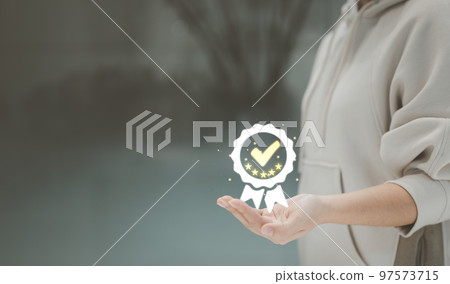 Woman hand show the sign of the top service quality assurance, guarantee standards, customer service, satisfaction experience, best marketing success, iso certification and standardization concept, 97573715