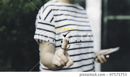 Woman client pressing smiley face emoticon on virtual touch screen. best rating positive, quality review, feedback survey, marketing performance, satisfaction user, Customer service evaluation concept 97573753