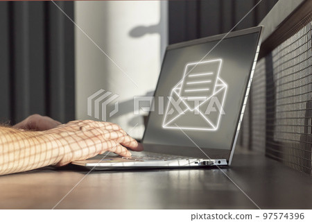 Spam email. Man receiving junk mail, unwanted messages, ads for money scams while working on laptop. Hands on keyboard closeup Spam email. Man receiving junk mail, unwanted messages, ads for money scams while working on laptop. Hands on keyboard closeup 97574396
