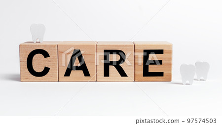 Tooth care concept. Word on cubes. Stomatology 97574503