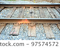 Vintage railroad tracks displayed outdoors. 97574572