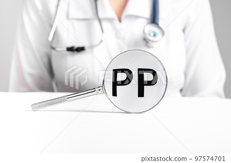 PP vitamin, word acronym through magnifying glass PP vitamin, word acronym through magnifying glass 97574701