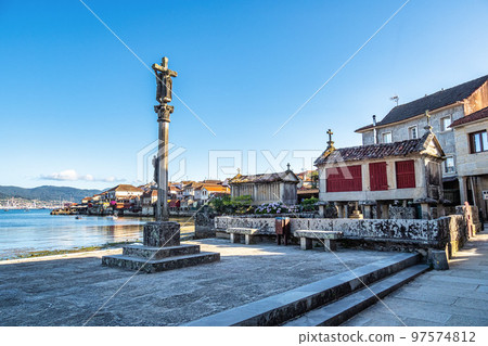 Fishing village of Combarro with the typical granary horreos. Galicia, Spain. 97574812