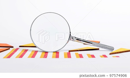 Magnifying glass with graphs showing slowdown in business development. Economic crisis, market decline analysis. Finance and planning concept Magnifying glass with graphs showing slowdown in business development. Economic crisis, market decline analysis. Finance and planning concept 97574906