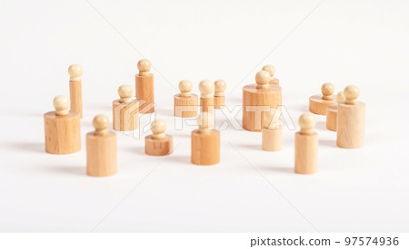 Montessori knobbed cylinders placed in random order. Puzzle pieces of various diameter and height. Disorder, confusion concept. 97574936