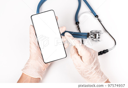 Stethoscope and doctor hands holding phone mockup for online medical consultation, communication with patient or using health tracker app in smartphone. 97574937